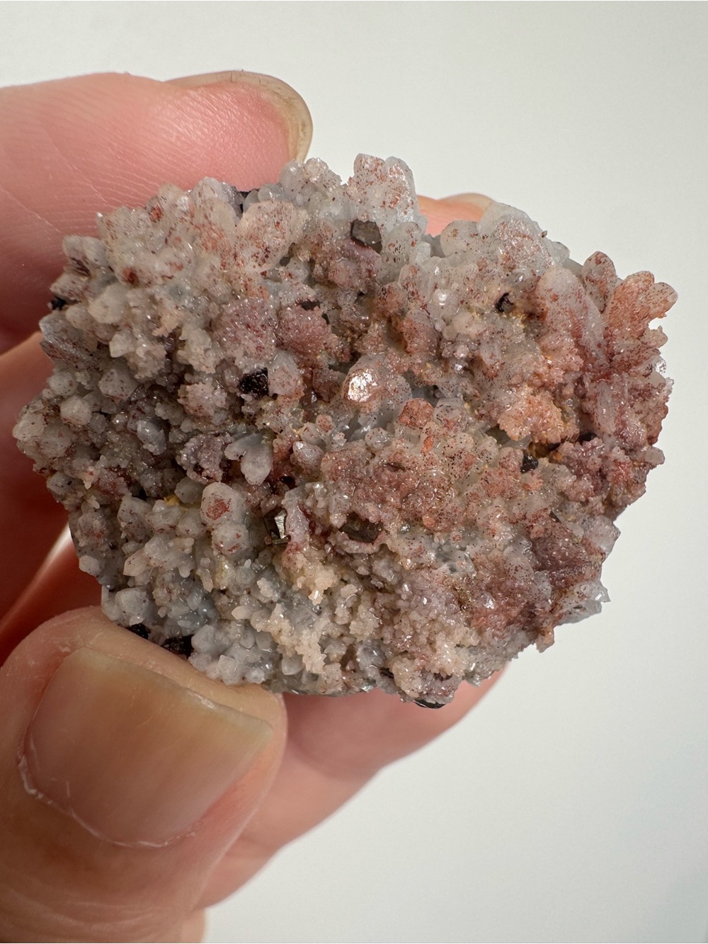 Red crystal with pyrite
